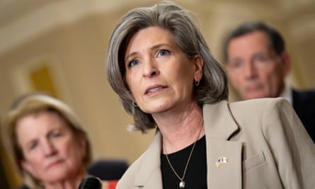 woman wearing tan suit and black shirt