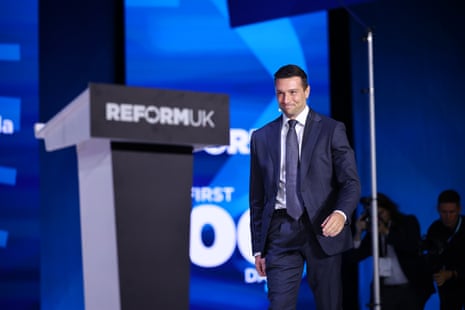 Jordan Bardella gets on the stage to deliver a speech during the second day of Reform UK conference.