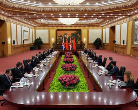 Keir Starmer, fifth from right, and Xi Jinping, sixth left, and their delegations participate in the meeting in Beijing