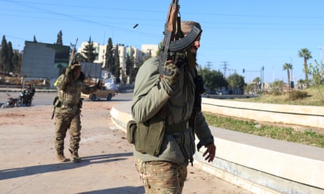 Opposition fighters in Aleppo, Syria, on 30 November 2024.