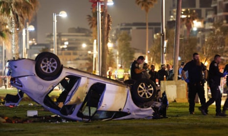 An overturned car in the aftermath of the attack in Tel Aviv, Israel, on Friday night