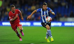 Anthony Pilkington, left, wearing the red Cardiff City home kit in August 2014 that would become their away strip in January 2015.