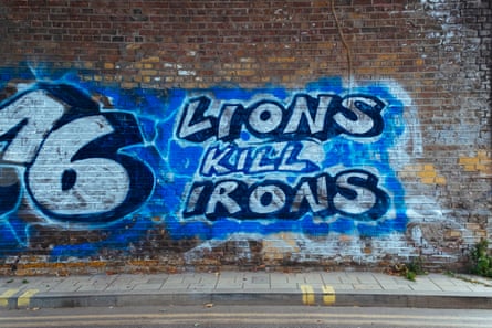 Graffiti on a wall near the Den that reads: ‘Lions Kill Irons’