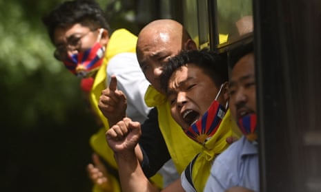 Activists of the Tibetan Youth Congress (TYC) after being detained by police during a protest outside the China embassy in New Delhi on the 100th anniversary of the founding of the Chinese Communist party.