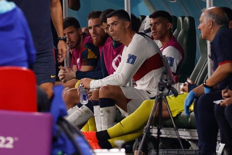 Cristiano Ronaldo of Portugal sits on the bench after being substituted.