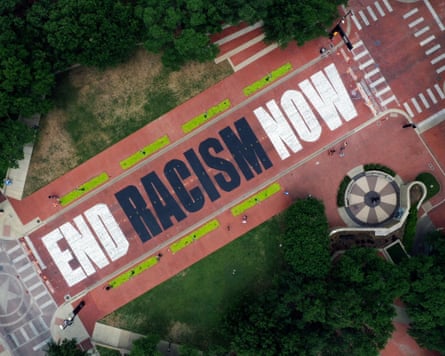An aerial view of a mural with the words “End Racism Now”, painted on Main Street in Fort Worth, Texas.
