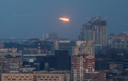 A missile explodes in the sky over Kyiv, Ukraine, on 29 December.