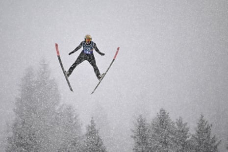 Germany's Vinzenz Geiger sails through the snowy sky.
