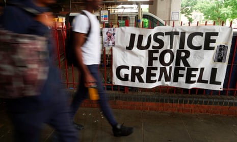A sign reading Justice for Grenfell near the site of the blaze in west London.