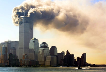 Balls of flames and smoke billow out of the top floors of the World Trade Center Towers 11 September 2001 in New York City