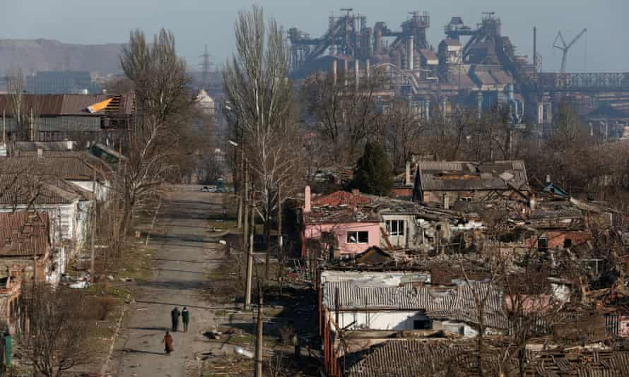 The Azovstal iron and steelworks behind damaged buildings in Mariupol on 28 March.