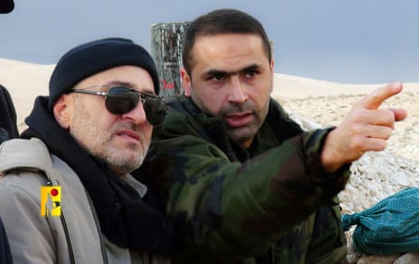 This undated picture released by Hezbollah Military Media, shows senior Hezbollah commander Wissam Hassan al Tawil, right.