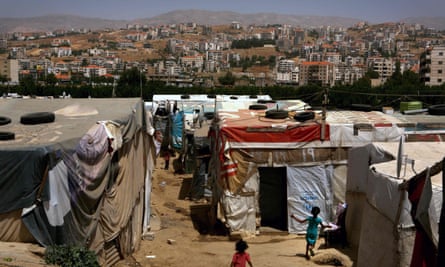 Syrian children play in a makeshift refugee camp in Lebanon’s Bekaa Valley.