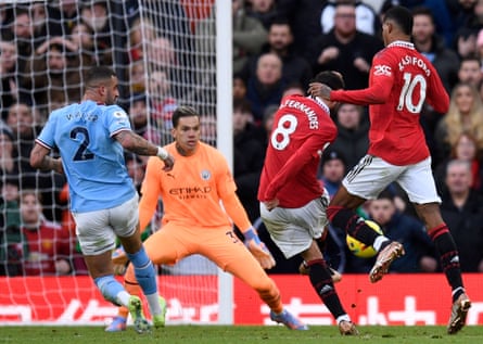 Manchester United’s Bruno Fernandes (centre) scores the equalising goal past Manchester City’s Ederson at Old Trafford