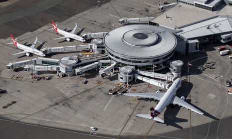 Planes at a terminal at Sydney airport, seen from above
