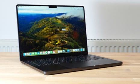 Apple 14in MacBook Pro M3 Max review in space black on a table.