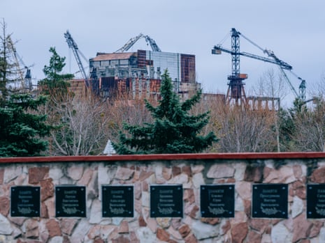 Stalled construction of reactors 5 and 6 in Chornobyl. The memorial wall shows plaques for participants in the liquidation of the site and victims of the disaster.