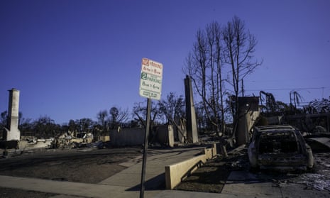 Blue sky and burned-out homes