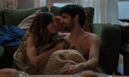 The couple in the front room with no clothes in, wrapped in blankets