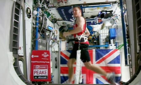 Astronaut Tim Peake running the London marathon while strapped to a treadmill. Scientists suggest a tailored exercise regime could help offset back problems.