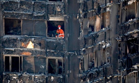 Firefighters inside the charred remains of Grenfell Tower on Saturday 17 June.