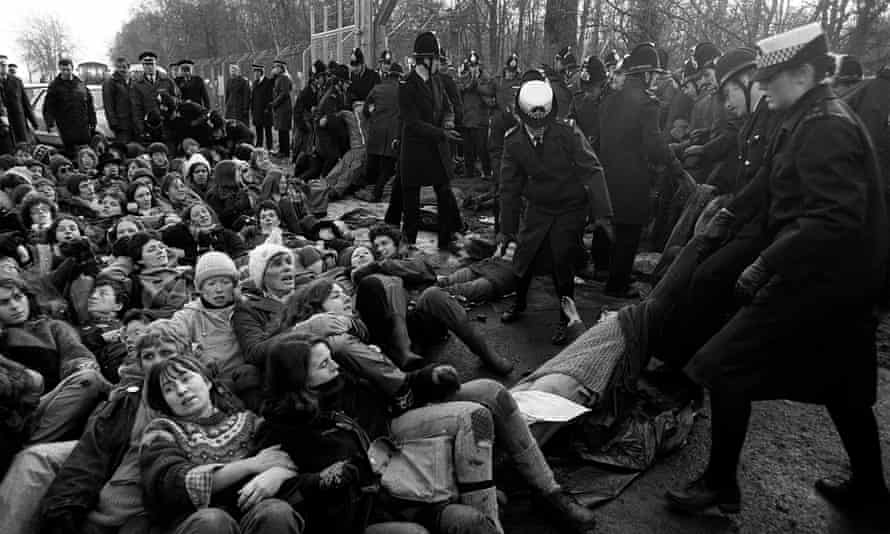 Police drag away anti-nuclear demonstrators at the Greenham Common in 1982.