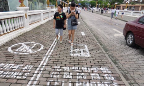 Mind your step: The mobile phone lane for pedestrians in Chongqing, China.