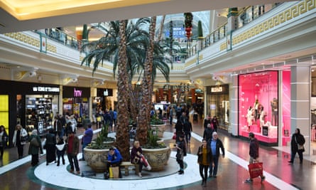 Shoppers in the Trafford Centre, a shopping mall until recently owned by Peel Holdings.