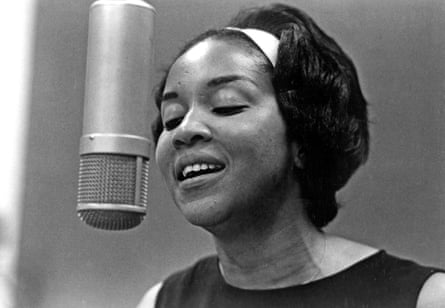 Staples singing in front of a microphone, circa 1970.