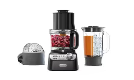 A black Kenwood MultiPro XL Food Processor with various attachments to its left and a jug to the right