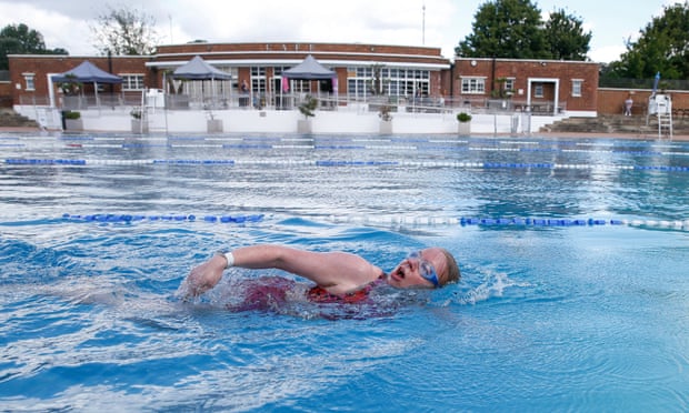 A woman swimming at Parliament Hill lido in London