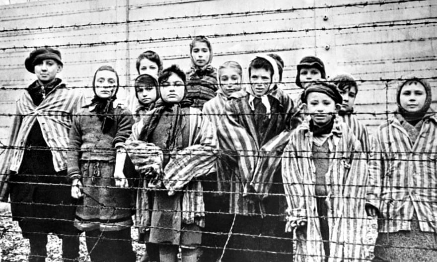 Eva Mozes Kor and her twin sister, Miriam Mozes Zeiger, are to the right of this group of children who survived Auschwitz-Birkenau. The picture was taken in January 1945 on the day it was liberated by the Red Army. The children are (left to right): Tomy Schwarz (later Shacham), Miriam Ziegler, Paula Lebovics (front), Ruth Webber, Berta Weinhaber (later Bracha Katz), Erika Winter (later Dohan), Marta Weiss (later Wise), Eva Weiss (later Slonim), Gabor Hirsch (just visible behind Eva Weiss), Gabriel Neumann, Robert Schlesinger (later Shmuel Schelach), Eva Mozes Kor, and Miriam Mozes Zeiger. (Photo by Alexander Vorontsov/Galerie Bilderwelt/Getty Images)