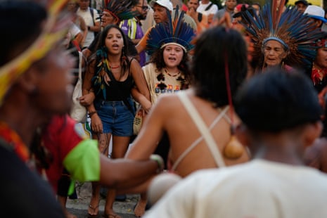 People sing and dance as they participate in the People’s Summit opening ceremony.