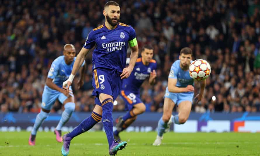 Real Madrid’s Karim Benzema scores his side’s third goal from the penalty spot.