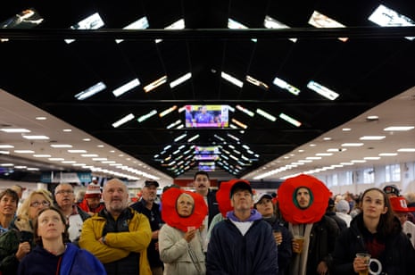 England fans at Ashton Gate watch a TV screen showing the climax of the France v Ireland quarter-final in Exeter before England’s quarter-final against Scotland.