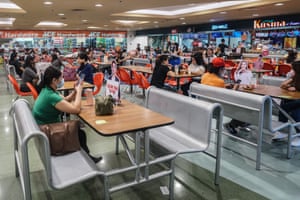 Coronavirus live news: UK records 21,502 new cases and 519 deaths; Peru suspends trials of China vaccine | World news 5 Filipinos wear face masks as they flock to the mall amid the Covid-19 pandemic in Manila, Philippines on 12 December, 2020.