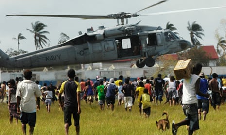 Miskito Indians surround a US helicopter bringing humanitarian aid to north-eastern Nicaragua, in September 2007.