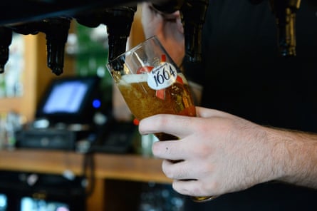 Close up of a pint of lager being pulled in a pub