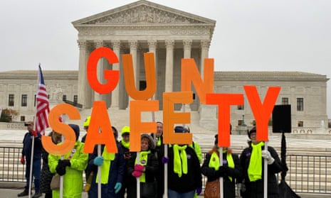 People rally for gun control laws in front of the US supreme court in 2019. 