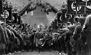 German chancellor Adolf Hitler amid huge crowds at a rally to mark the Bückeberg Harvest Festival on 1 October 1934.