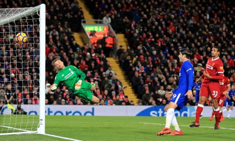 Liverpool goalkeeper Simon Mignolet dives in vain as Chelsea’s Willian scores the equaliser