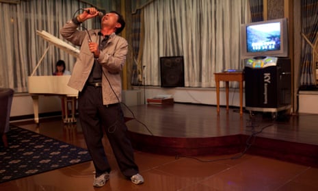A (drunk?) North Korean man sings karaoke a hotel bar in Mount Kumgang, North Korea.