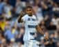 André Luiz of Sporting Kansas City points forward with a determined expression during a match