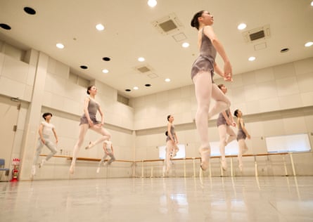 Students from the New National Theatre Ballet School (NNT Ballet School) take part in a daily ballet class