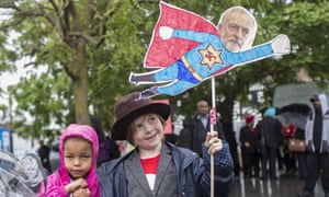 Young Jeremy Corbyn supporters with placard
