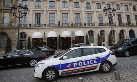 A police car drives past the Ritz hotel in Paris, Thursday, Jan. 11, 2018.