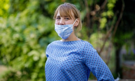 Woman wears mask over mouth, not nose