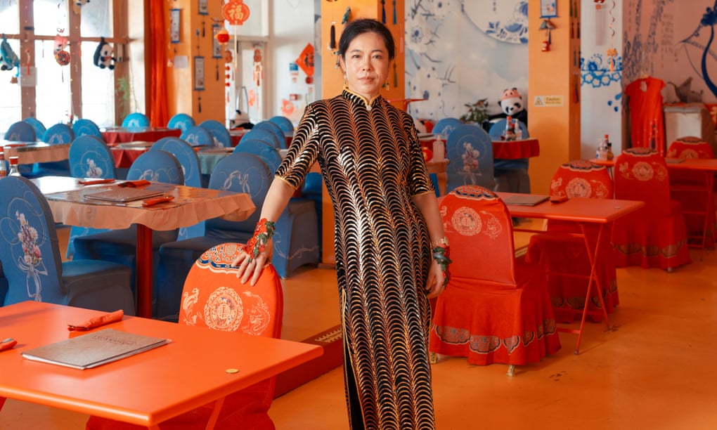 Dress to impress: Gigi Gao dazzles Swansea at her restaurant.