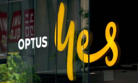 An illuminated sign is displayed in the window of an outlet for the Australian communications company Optus in Sydney on November 9, 2023.