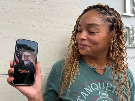 Shakeira Fairfax holds up a photo of Jada on her phone